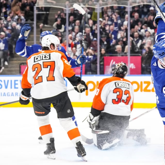 Toronto Maple Leafs' John Tavares (91) celebrates after scoring on Philadelphia Flyers goaltender Samuel Ersson (33) during second period NHL hockey action in Toronto, on Tuesday, March 25, 2025. THE CANADIAN PRESS/Chris Young