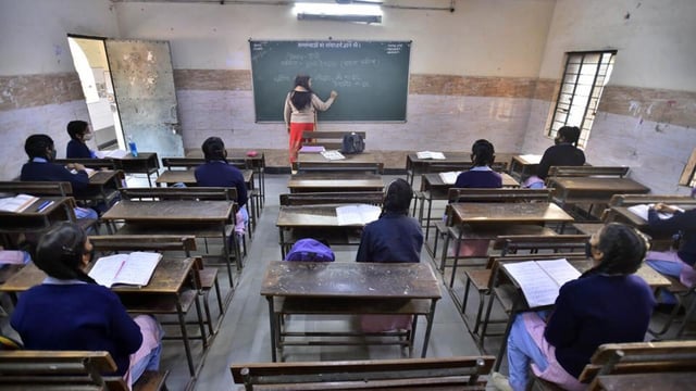 New Delhi, India - February 7, 2022: Students are seen maintaining social distancing norms inside a classroom at Government Sarvodaya Girls Senior Secondary School at Trilok Puri in New Delhi, India, on Monday, February 7, 2022. The Delhi Disaster Management Authority (DDMA) had on Friday decided to reopen higher education institutions and coaching centres along with schools for classes 9-12 from February 7. (Photo by Raj K Raj / Hindustan Times) (Hindustan Times)