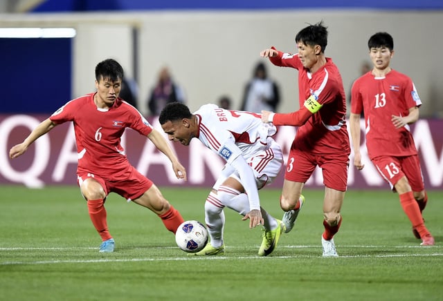 Soccer Football - World Cup - AFC Qualifiers - Third Round - Group A - North Korea v United Arab Emirates - Prince Faisal Bin Fahd Stadium, Riyadh, Saudi Arabia - March 25, 2025 North Korea's Tam Kye in action with United Arab Emirates' Bruno REUTERS/Stringer