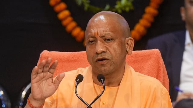 : Uttar Pradesh Chief Minister Yogi Adityanath addresses a press conference on the completion of eight years of the state government, in Lucknow, March 24, 2025. 