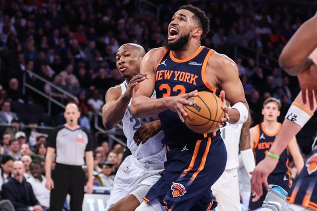 Mar 25, 2025; New York, New York, USA;  New York Knicks center Karl-Anthony Towns (32) drives past Dallas Mavericks forward Kai Jones (23) in the first quarter at Madison Square Garden. Mandatory Credit: Wendell Cruz-Imagn Images