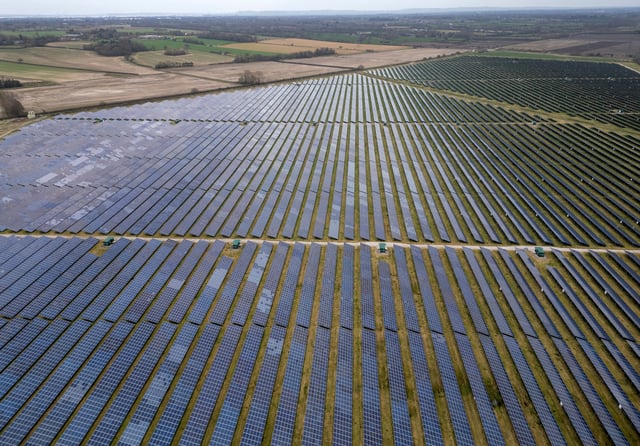 A drone view shows rows of solar panels as part of the Shotwick Solar Park in Shotwick, Britain, March 17, 2025. REUTERS/Phil Noble/File Photo