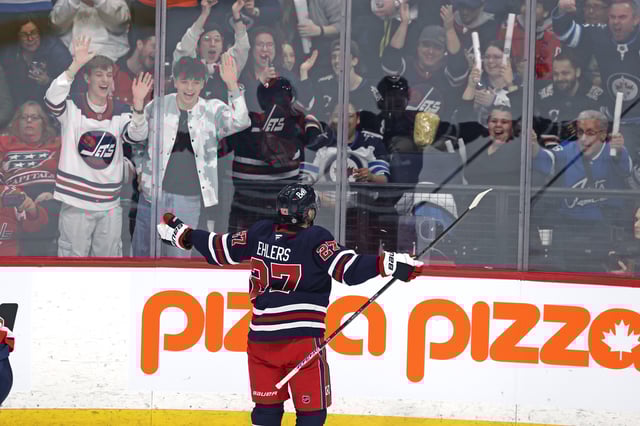 Mar 25, 2025; Winnipeg, Manitoba, CAN; Winnipeg Jets left wing Nikolaj Ehlers (27) celebrates his overtime goal against the Washington Capitals at Canada Life Centre. Mandatory Credit: James Carey Lauder-Imagn Images