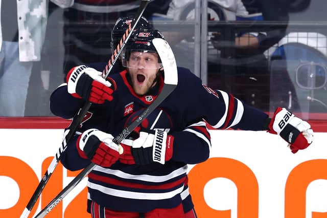Mar 25, 2025; Winnipeg, Manitoba, CAN; Winnipeg Jets left wing Nikolaj Ehlers (27) celebrates his overtime goal against the Washington Capitals at Canada Life Centre. Mandatory Credit: James Carey Lauder-Imagn Images