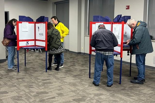 People cast their ballots at an early voting station for April 1 elections which include a seat on the Wisconsin Supreme Court, in Green Bay, Wisconsin, U.S. March 19, 2025.  REUTERS/Eric Cox