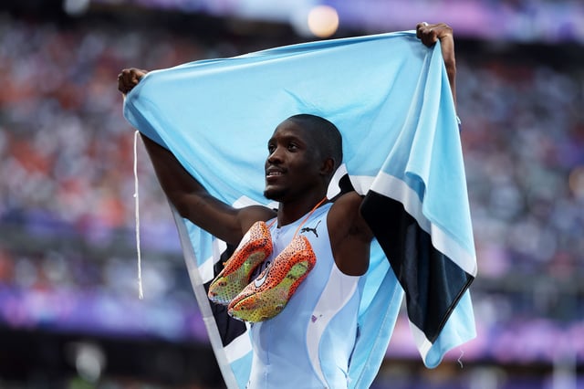 Letsile Tebogo celebrates winning the 200m gold medal at the 2024 Olympics in Paris.