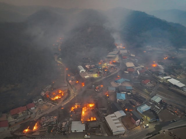 Billowing smoke from a wildfire that ravaged homes in Andong, South Korea, March 25, 2025.
