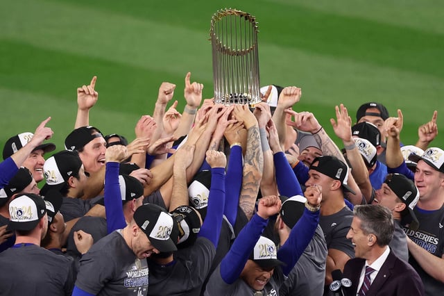 NEW YORK, NEW YORK - OCTOBER 30:  The Los Angeles Dodgers celebrate with the trophy after defeating the New York Yankees 7-6 in game 5 to win the 2024 World Series at Yankee Stadium on October 30, 2024 in the Bronx borough of New York City. (Photo by Luke Hales/Getty Images)