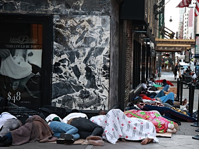 Migrants are seen sleeping outside the Roosevelt Hotel in Midtown Manhattan early Monday July 31, 2023. Asylum seekers are camping outside the Roosevelt Hotel as the Manhattan relief center is at capacity.  (Photo by: Luiz C. Ribeiro for New York Daily News)