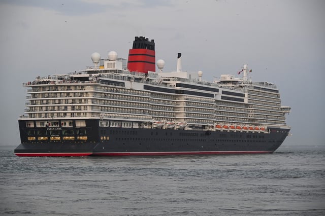 MS Queen Anne, a 113,000 GT Pinnacle class cruise ship operated by Cunard Line, leaving Lisbon cruise terminal on September 19, 2024, in Lisbon, Portugal.