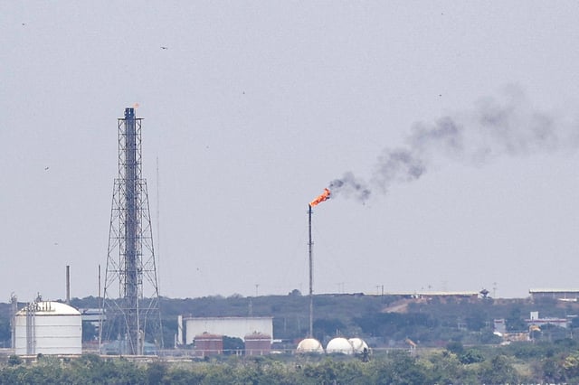 An oil refinery is seen from Maracaibo, Zulia State, Venezuela on March 19, 2025.