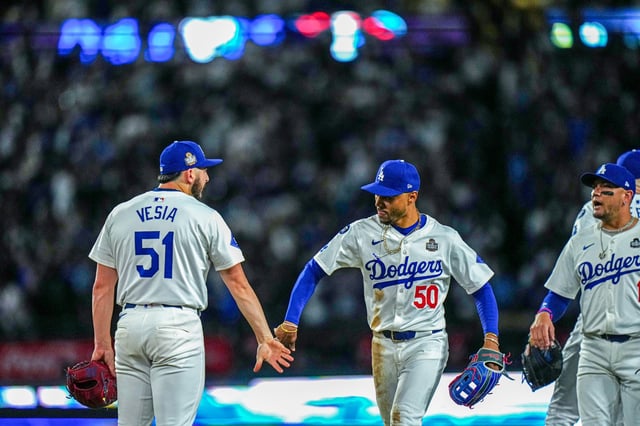 Alex Vesia and Mookie Betts of the Los Angeles Dodgers celebrate after the Dodgers defeated the New York Yankees at Dodger Stadium on Oct.26, 2024, in Los Angeles, Calif.