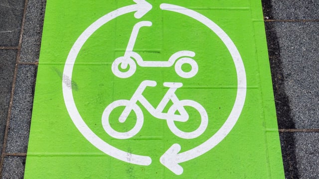 Electric bicycle and scooter recharging parking symbol, Brussels, Belgium