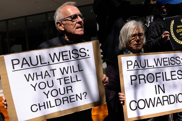 Protests outside of the offices of Paul, Weiss, Rifkind, Wharton & Garrison (Photo by Michael M. Santiago/Getty Images)