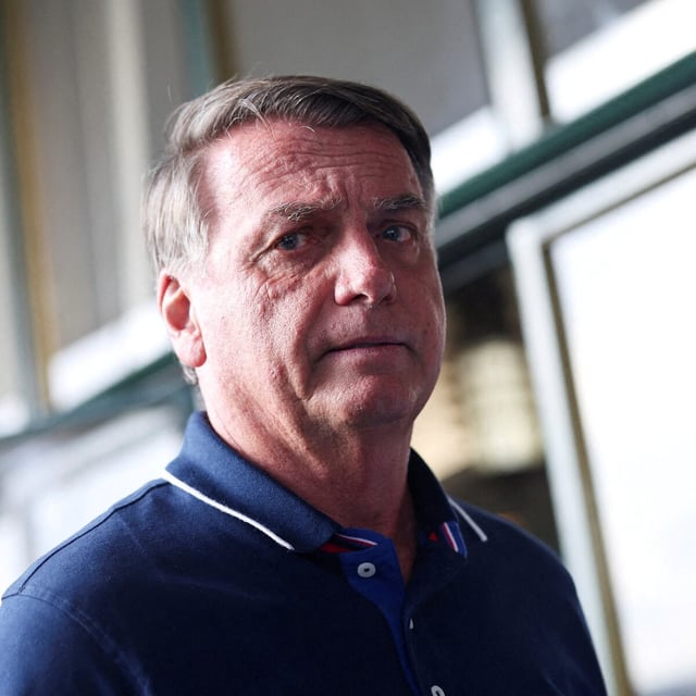 FILE PHOTO: Former Brazilian President Jair Bolsonaro walks outside Congonhas airport as he arrives in Sao Paulo, Brazil, March 24, 2025. REUTERS/Amanda Perobelli/File Photo