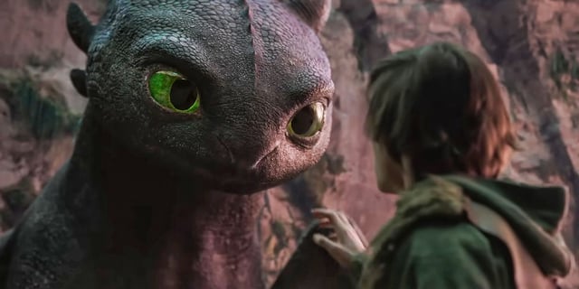 Toothless looking at Hiccup in the 2025 live-action remake of 'How To Train Your Dragon'