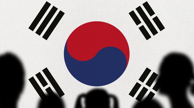 Silhouette of a family with the South Korean Flag in the background