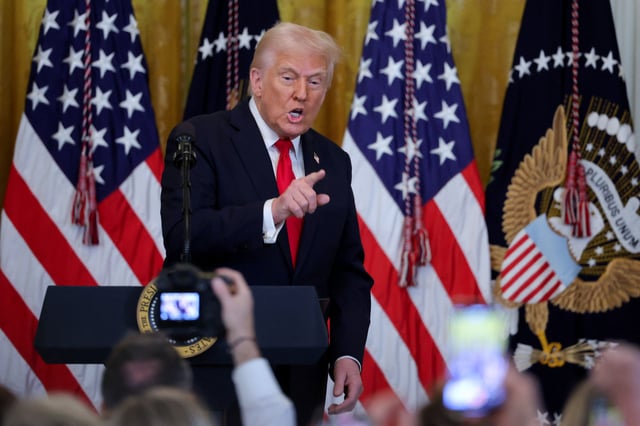 U.S. President Donald Trump attends a Women's History Month event at the White House in Washington, D.C., U.S., March 26, 2025. REUTERS/Carlos Barria