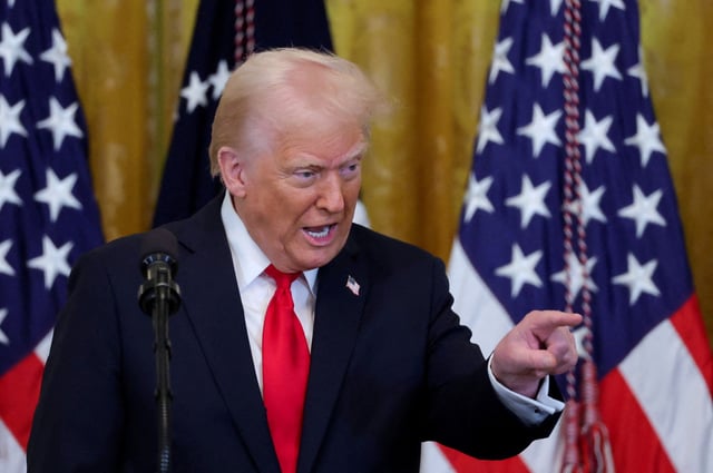 U.S. President Donald Trump gestures during a Women's History Month event at the White House in Washington, D.C., U.S., March 26, 2025. REUTERS/Carlos Barria