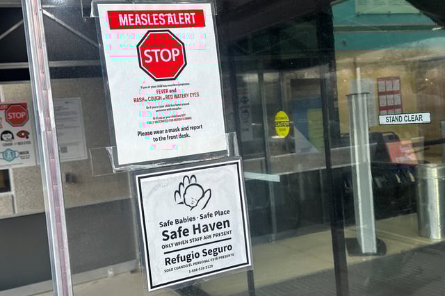 A measles alert sign hangs outside the entrance to the Cohen Children's Medical Center, where the state health department confirmed that a baby tested positive and that there is a possibility of exposure to others at the facility, in New Hyde Park, New York, U.S., March 14, 2025.