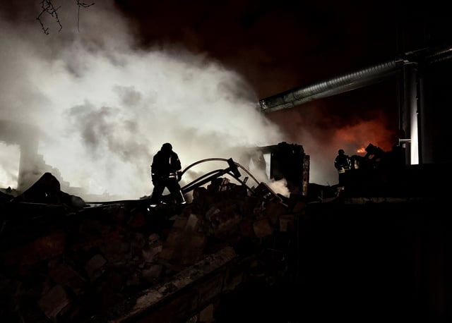 Rescuers work at the site a Russian drone strike, amid Russia's attack on Ukraine, in Kharkiv, Ukraine March 26, 2025. REUTERS/Stringer