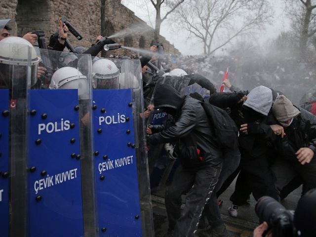 Riot police officers clash with protesters during a protest after Istanbul's Mayor Ekrem Imamoglu was arrested and sent to prison, in Istanbul, Turkey, Sunday, March 23, 2025. (Huseyin Aldemir/AP)