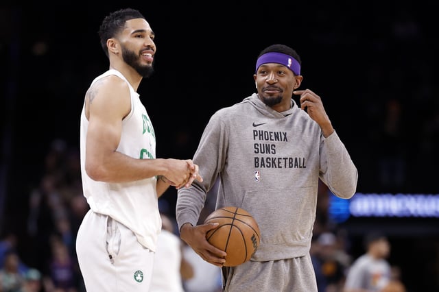 Bradley Beal #3 of the Phoenix Suns talks with Jayson Tatum #0 of the Boston Celtics before the game at Footprint Center on March 09, 2024 in Phoenix, Arizona. The Celtics defeated the Suns 117-107.