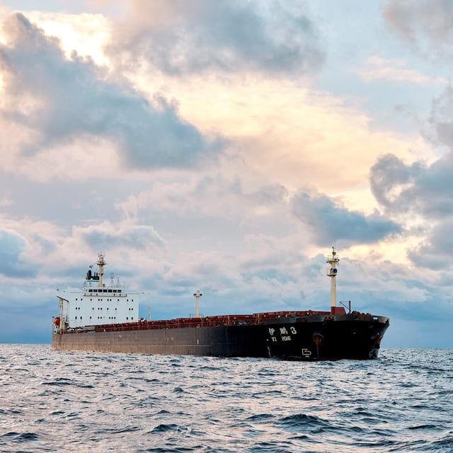 (FILES) In this file photo taken on November 20, 2024 the Chinese ship, the bulk carrier Yi Peng 3 is anchored and being monitored by a Danish naval patrol vessel (unseen) in the sea of Kattegat, near the City og Granaa in Jutland, Denmark. Denmark's navy said on November 20, 2024 it was shadowing a Chinese cargo vessel in the Baltic Sea, a day after Finland and Sweden opened investigations into suspected sabotage of two severed undersea telecoms cables. "The Danish Defence can confirm that we are present in the area near the Chinese ship Yi Peng 3," the military wrote in an email to AFP, adding that it would make no further comment for the time-being. (Photo by Mikkel Berg Pedersen / Ritzau Scanpix / AFP) / Denmark OUT (Photo by MIKKEL BERG PEDERSEN/Ritzau Scanpix/AFP via Getty Images)