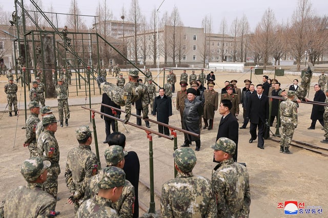North Korean leader Kim Jong Un watches a cadet practicing on the parallel bars during his visit to the Kang Kon Military Academy, in Pyongyang, North Korea, February 25, 2025.