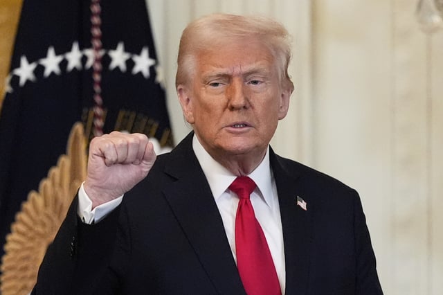 President Donald Trump gestures after speaking at a reception celebrating Women&#39;s History Month in the East Room of the White House, Wednesday, March 26, 2025, in Washington. (AP Photo/Mark Schiefelbein)