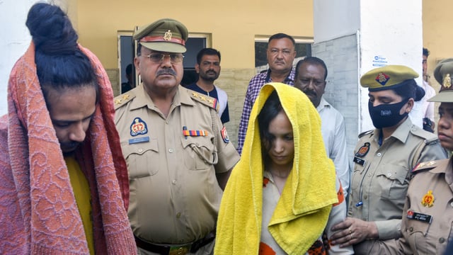 Police take away Merchant Navy officer Saurabh Rajput's wife Muskan and her lover Sahil Shukla after they were arrested in connection with his murder.