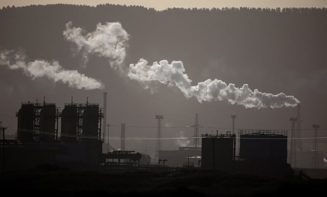 Steam comes out of chimneys at a chemical works near Redcar, Britain, January 30, 2023. REUTERS/Phil Noble/File Photo