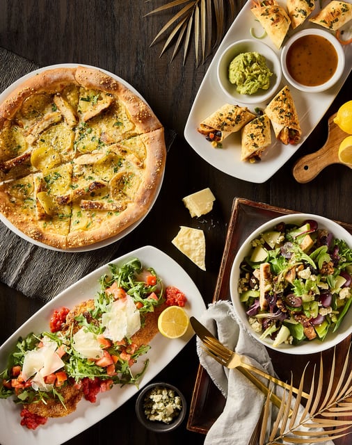 A collection of California Pizza Kitchen's 2025 seasonal menu items for the pizza chain's 40th anniversary.