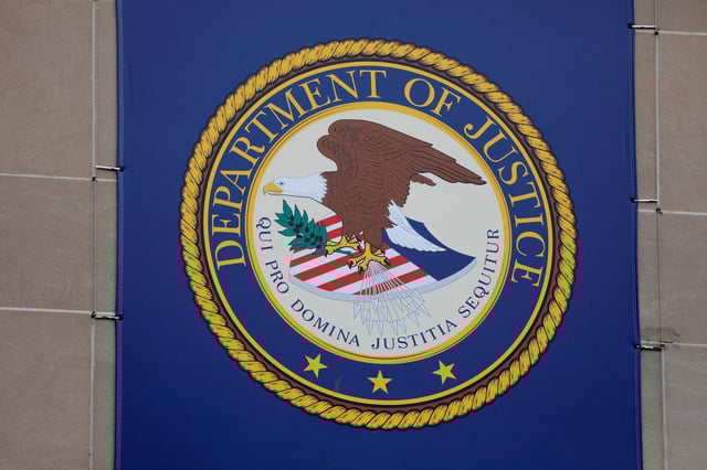 The crest of the United States Department of Justice (DOJ) is seen at their headquarters in Washington, D.C., U.S., May 10, 2021. REUTERS/Andrew Kelly/File Photo/File Photo
