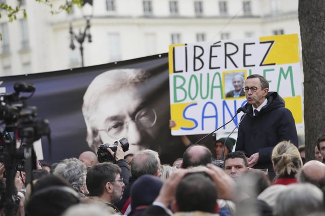 French Interior Minister Bruno Retailleau delivers a speech during a gathering in support of detained Franco-Algerian writer Boualem Sansal, in Paris, Tuesday, March 25, 2025. (AP Photo/Thibault Camus)