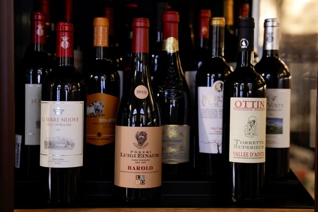 Bottles of Italian wine are stored in a fridge inside the wine shop Kabb in Rome, Italy, March 14, 2025. REUTERS/Remo Casilli/File Photo