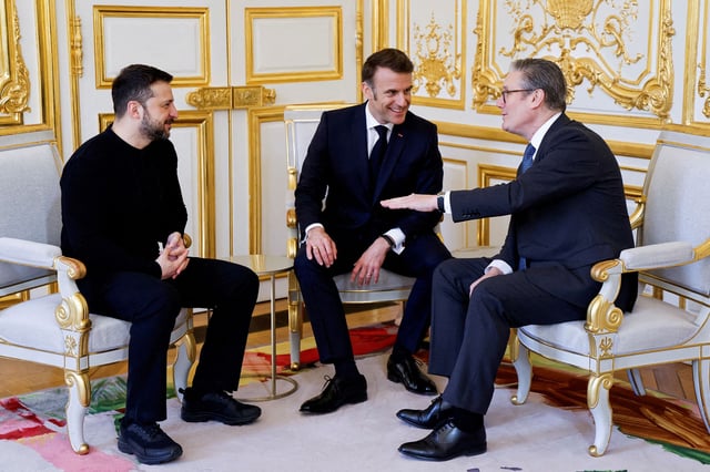 Ukraine's President Volodymyr Zelensky, France's President Emmanuel Macron and Britain's Prime Minister Keir Starmer speak during a trilateral meeting on the sidelines of Thursday's summit.