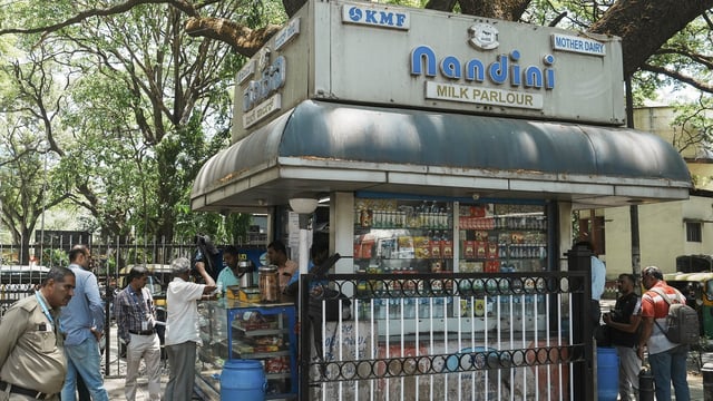 Customers at a Nandini milk shop in Bengaluru.