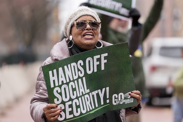 Demonstrators gather outside the Edward A. Garmatz United States District Courthouse in Baltimore on March 14, 2025, before a hearing regarding the Department of Government Efficiency&#39;s access to Social Security data.
