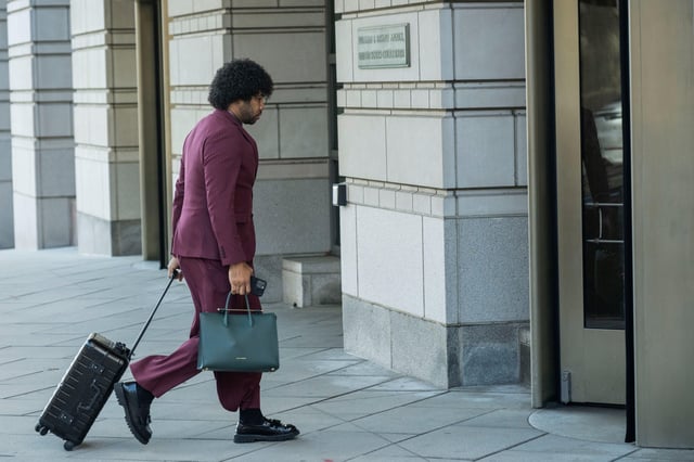 White House Correspondents' Association President Eugene Daniels arrives at the E. Barrett Prettyman Federal Courthouse before the start of a hearing on The Associated Press' lawsuit against the Trump Administration to restore access to presidential events, Thursday, March 27, 2025, in Washington. (AP Photo/Kevin Wolf)