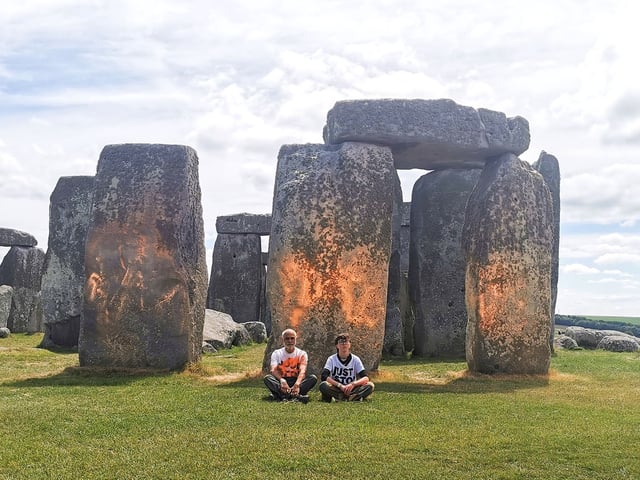 Just Stop Oil protesters after spraying an orange powder paint on Stonehenge in June 2024.