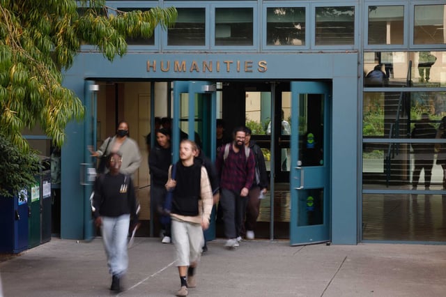 Students enter and exit the Humanities building between classes at San Francisco State University in September.