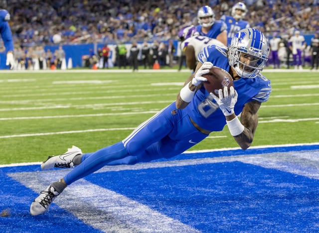 Dec 11, 2022; Detroit, Michigan, USA; Detroit Lions wide receiver Josh Reynolds (8) catches the ball for a touchdown against the Minnesota Vikings during the second half at Ford Field. Mandatory Credit: David Reginek-USA TODAY Sports/File Photo