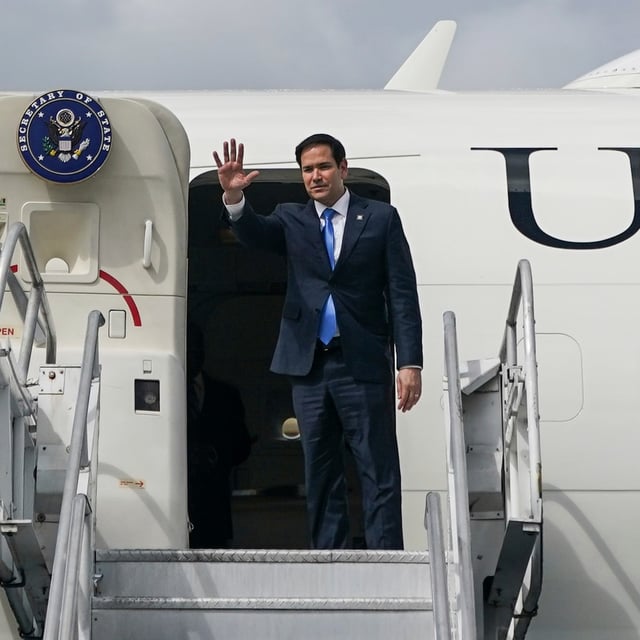U.S. Secretary of State Marco Rubio gestures as he boards an aircraft en route Suriname at Cheddi Jagan International Airport in Georgetown, Guyana, Thursday, March 27, 2025.  (Nathan Howard/Pool photo via AP)