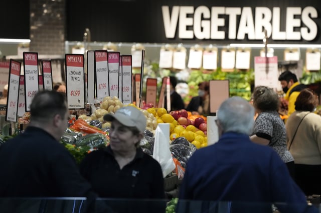 FILE - Shoppers look at produce at a shopping center in Sydney on Wednesday, July 27, 2022. (AP Photo/Rick Rycroft, File)