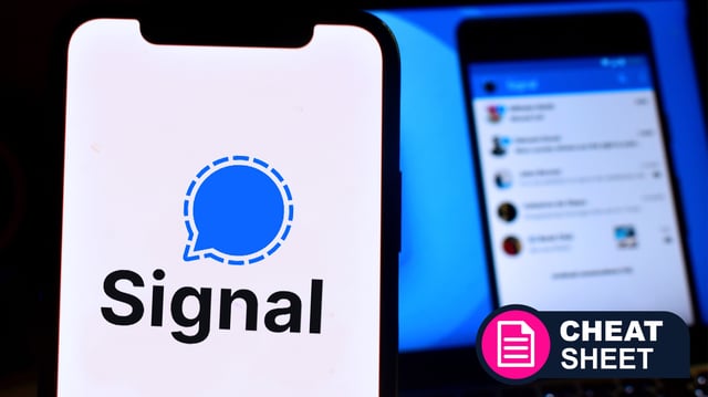 A mobile phone showing the Signal logo in front of a screen showing the app