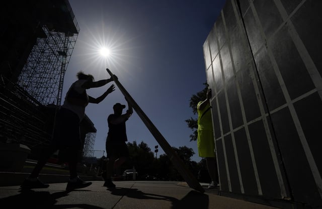 FILE - Advocates for cooling Texas prisons construct a makeshift cell before a rally on the steps of the Texas Capitol, Tuesday, July 18, 2023, in Austin, Texas. The group is called for an emergency special session to address the deadly heat effecting inmates. (AP Photo/Eric Gay, File)