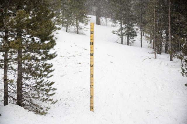 A post at Luther Pass in the Sierra in El Dorado County measures just under two feet on March 12. Snow levels have risen to near normal despite a dry January.