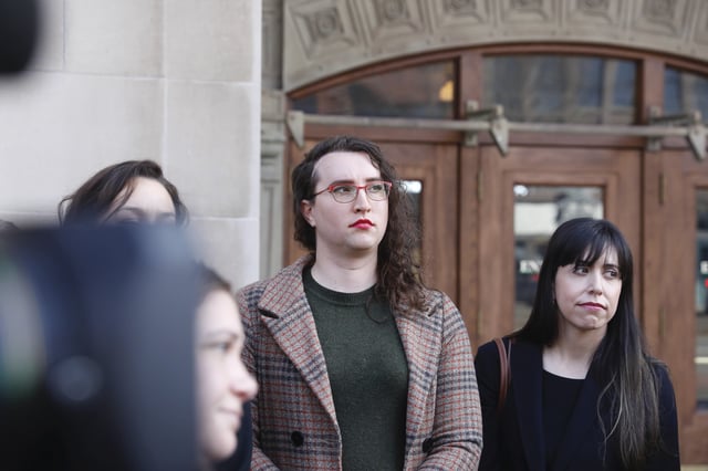 U.S. Army Sgt. 1st Class Sierra Moran, a transgender service member, listens during a press conference in Tacoma, Wash., on Tuesday, March 25, 2025. (AP Photo/Manuel Valdes)