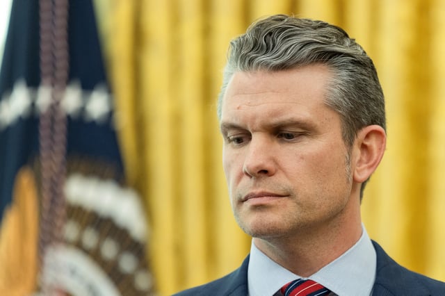 U.S. Defense Secretary Pete Hegseth looks on, as President Donald Trump (not pictured) delivers remarks, in the Oval Office at the White House, in Washington, D.C., U.S., March 21, 2025. REUTERS/Carlos Barria/File Photo